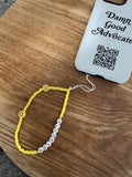 “Advocate” Phone Charm (Yellow + Blue)