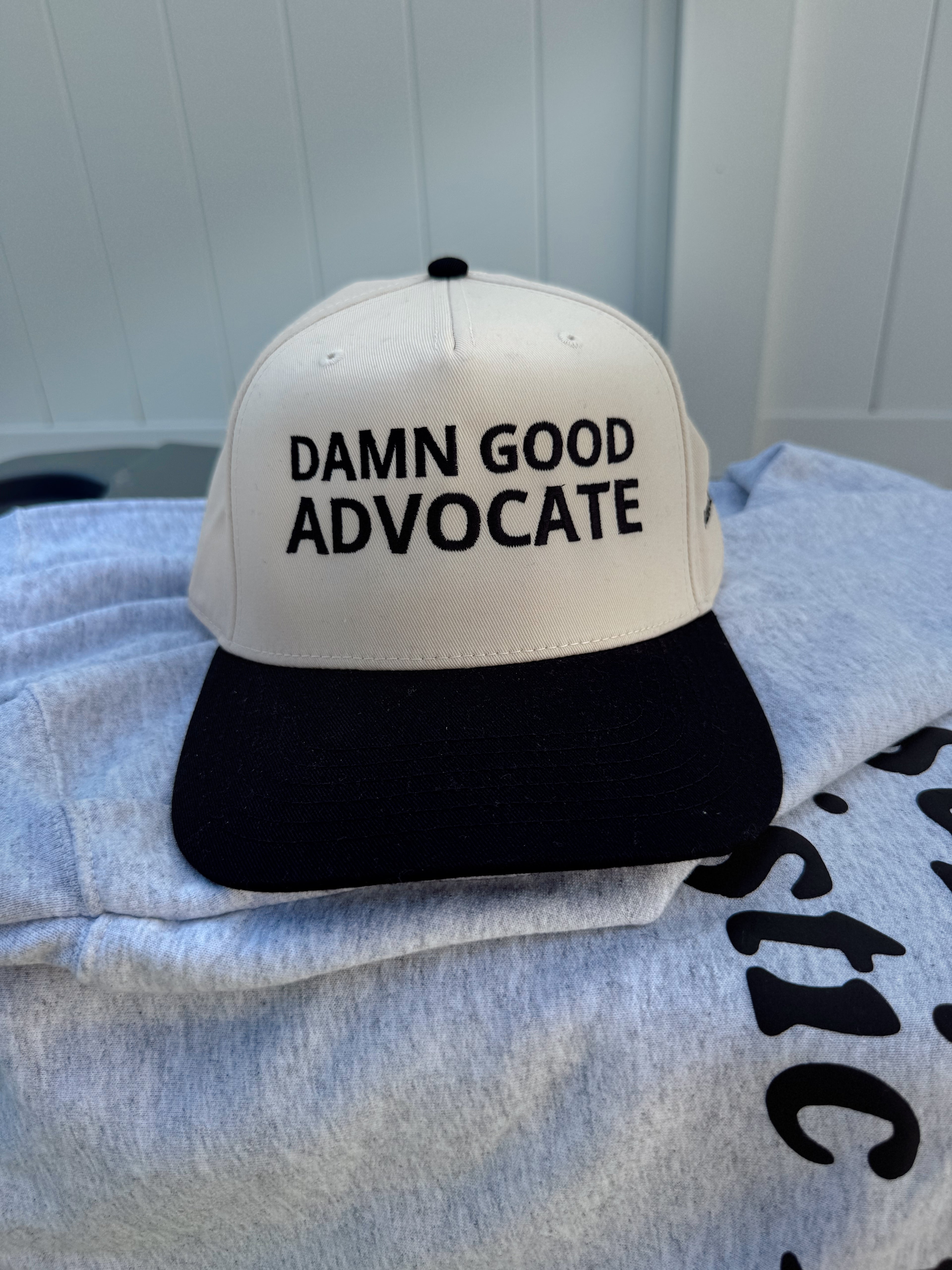 Damn Good Advocate™ Embroidered Hat in Black