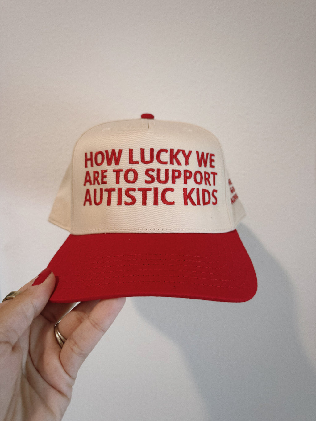 Embroidered "How Lucky We Are" Hat in Red